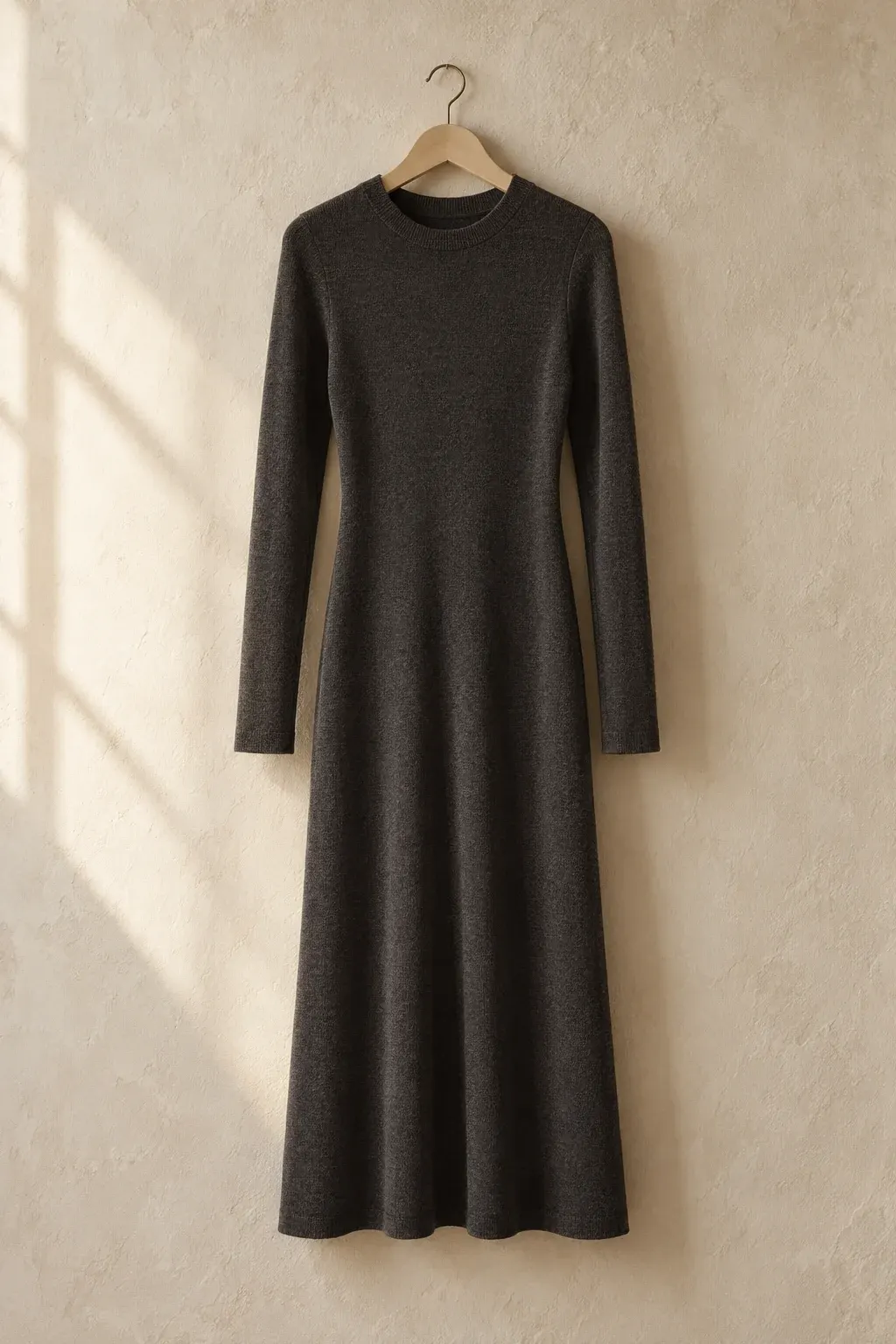 Charcoal fine-knit midi dress on a pale wooden hanger